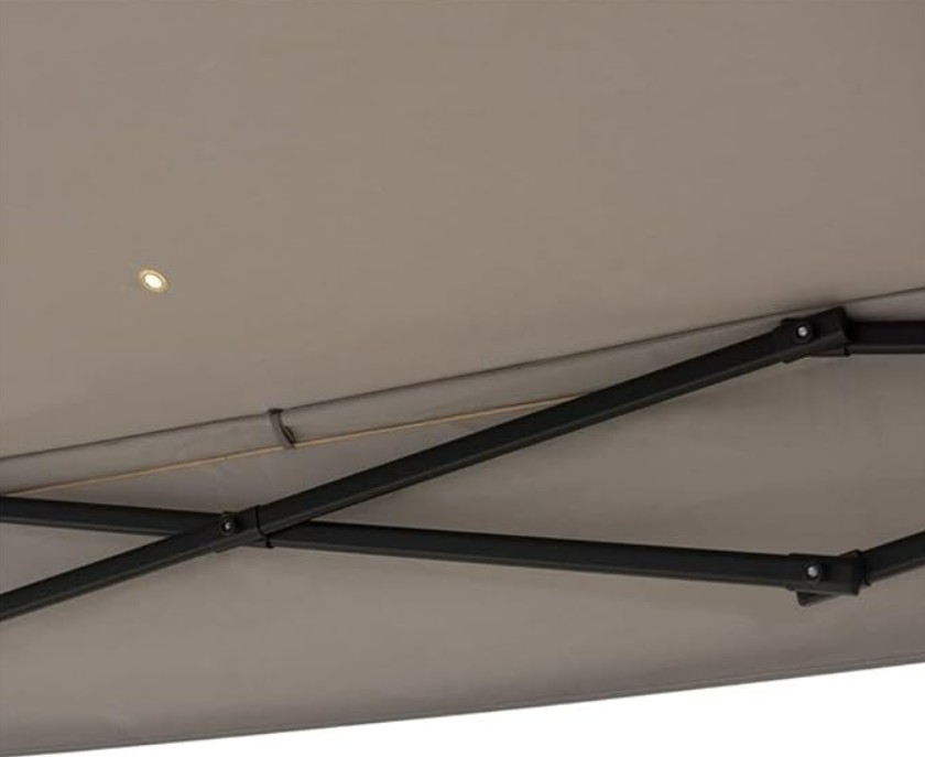 A close-up view of the underside of the 10.8 ft Pop-Up Gazebo Party Tent with Sheer Mesh Curtains, showing its beige canopy, sturdy metal frame, and a small light embedded in the fabric.